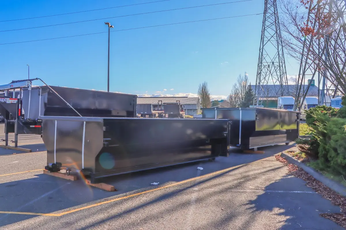 Roll-off dumpster ready for waste disposal at job site for 4 Yard Dumpster Rental in Holliston